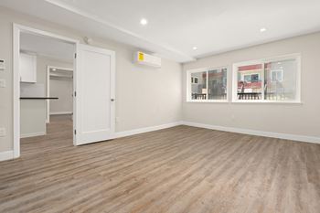 Primary bedroom with wood floors